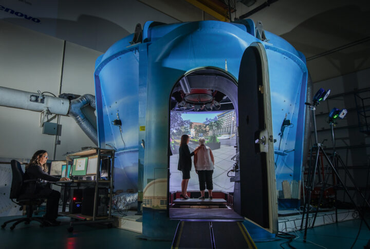Researchers and participants in a simulation lab