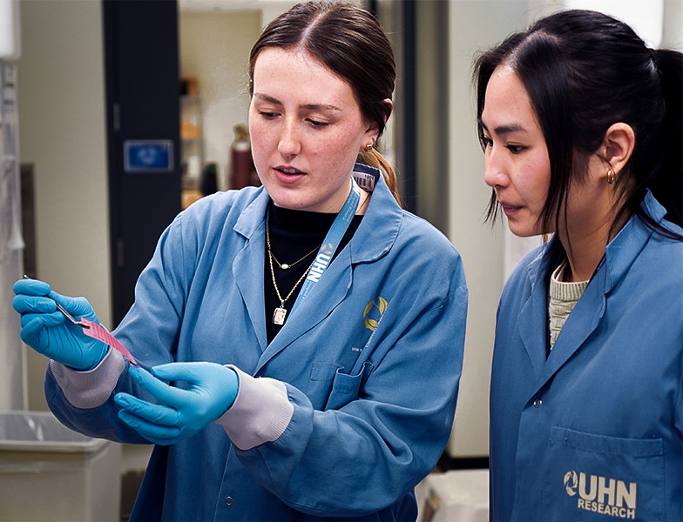 Two scientists discuss results of an experiment they are looking at.